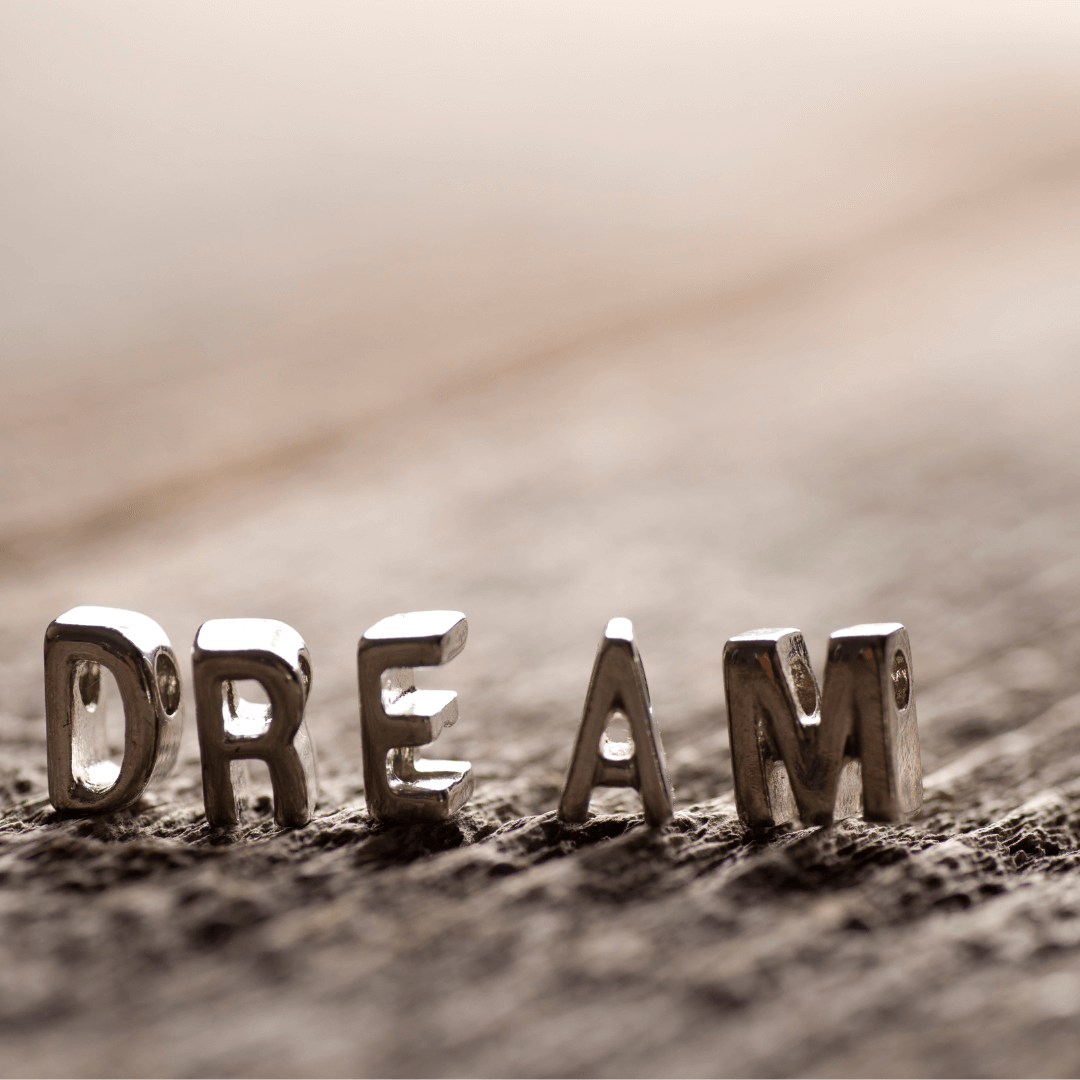 Image of letters D-R-E-A-M to symbolise dreaming big and building dreams working towards goals ambitions and aspirations.