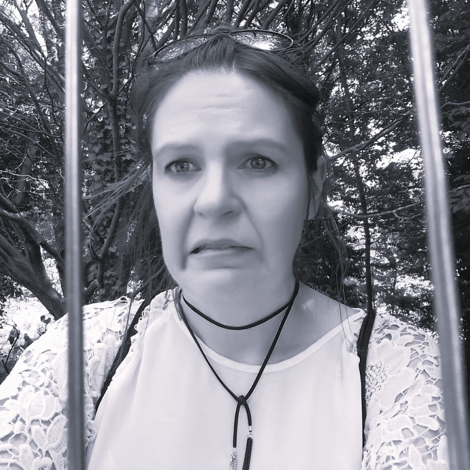 Addicted to Admin pretending to be in a prison cell due to the invisible workload she has on her plate.