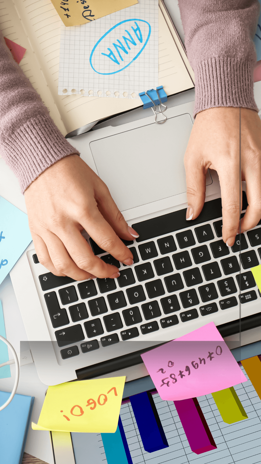 Keyboard, diary and post it notes all around