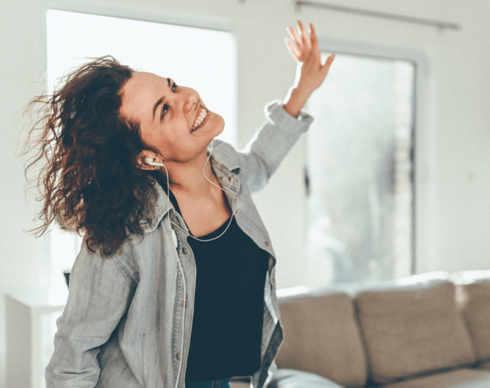 Lady dancing around the living room loving data entry
